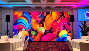 A vibrant custom backdrop at a business event