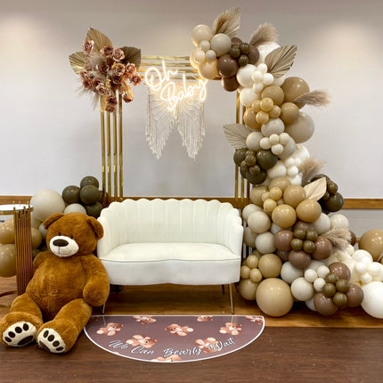 Elegant party setup featuring custom die cut floor adhesive with balloons and plush teddy bear