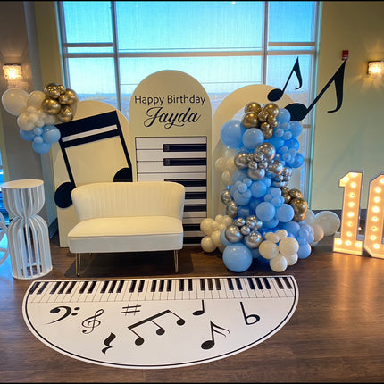 Custom die cut floor adhesive featuring piano keys and musical notes for birthday decoration