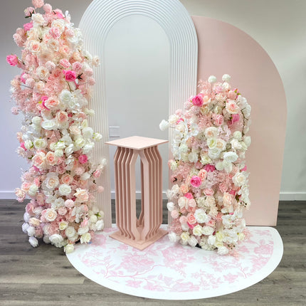 Custom die cut floor adhesive featuring floral designs on a pink and white backdrop for event decoration