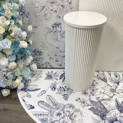 Elegant custom die cut floor adhesive with floral design, featuring a white pedestal in the background