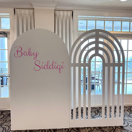 Custom foam backdrop printing featuring baby Siddiqi text and arch design in white by WPEProduction