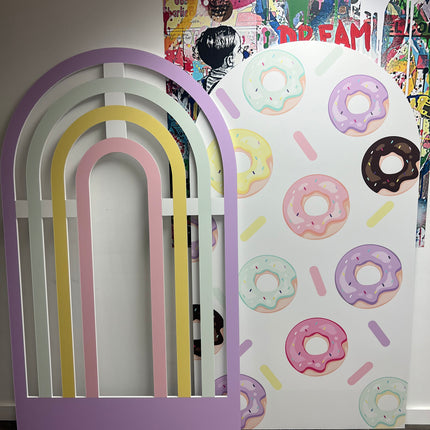 Colorful custom foam backdrop printing featuring rainbow shapes and donut patterns for event decoration