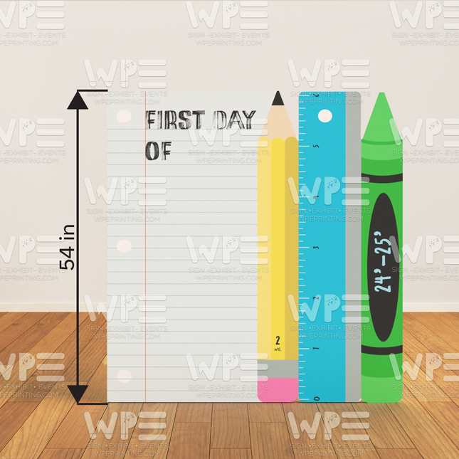 Custom paper cutout for events featuring large notebook paper pencil ruler and crayon on wooden floor