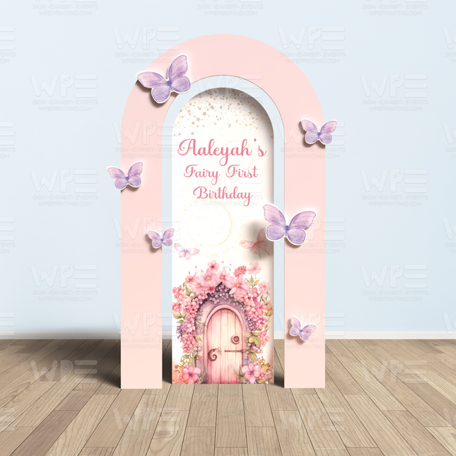 Fairy first birthday party decorations backdrop with pink arch, butterflies, and floral door design