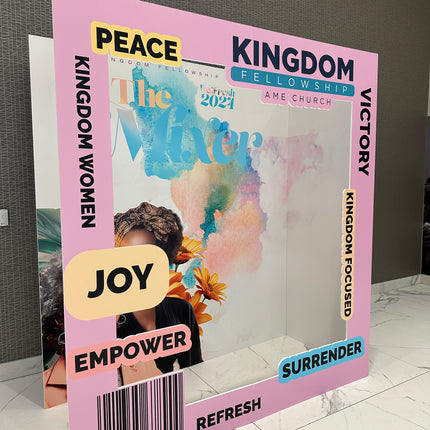 Custom 3D magazine booth featuring vibrant colors and uplifting messages for an event backdrop