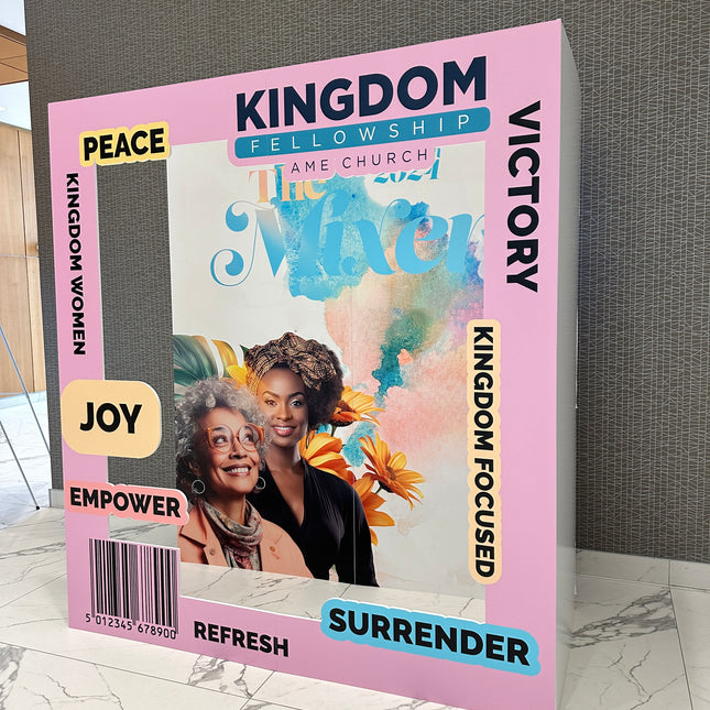 Custom 3D magazine booth featuring vibrant colors and motivational themes for events.