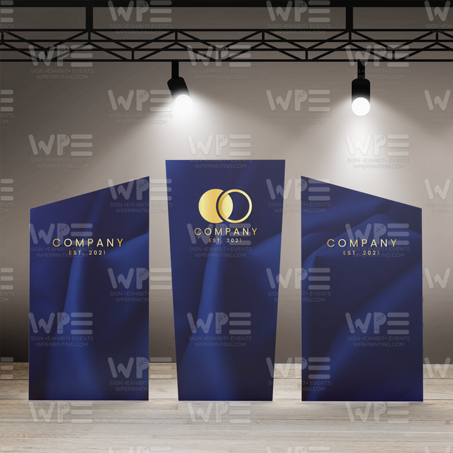 Three personalized stage backdrop panels in blue featuring company logo and established date