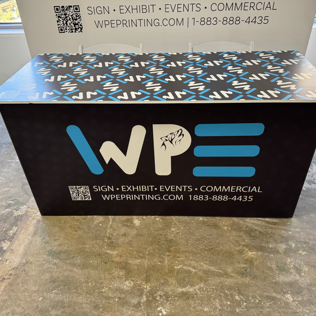 Custom branded table by WPE Production for exhibitions and events with a stylish design