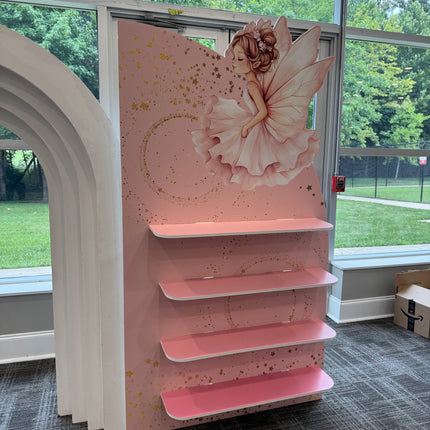 Pink custom printed fairy favor wall with fairy illustration and display shelves by WPE Production